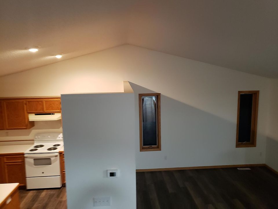 Looking down from staircase kitchen is to the left and lining room to the right.