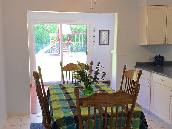 Family can socialize together here for dinner in the eating area - ceiling fan provides a nice breeze when you don't want to use your central air