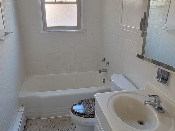 Bathroom has tub-shower