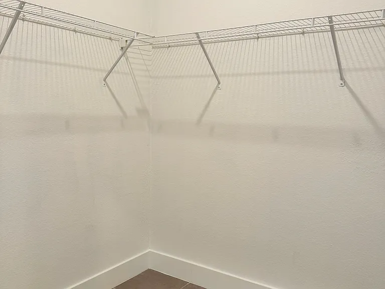 Walk in primary bedroom closet