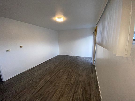 Large family room with new laminate flooring.