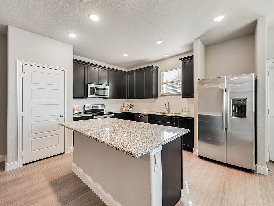 Gourmet kitchen with oversized island and granite counters