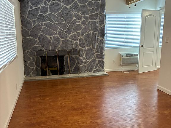 Master with fireplace and wood beamed ceilings.