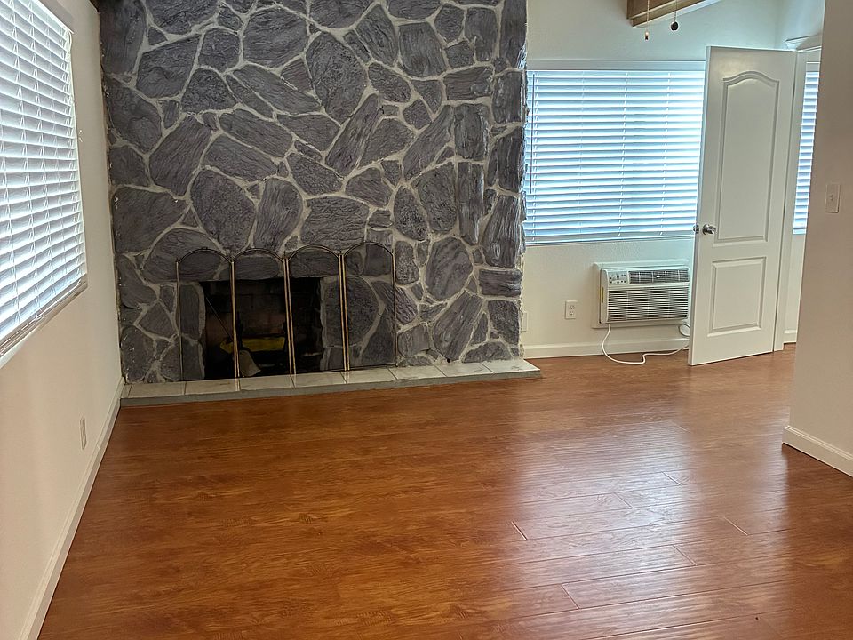 Master with fireplace and wood beamed ceilings.