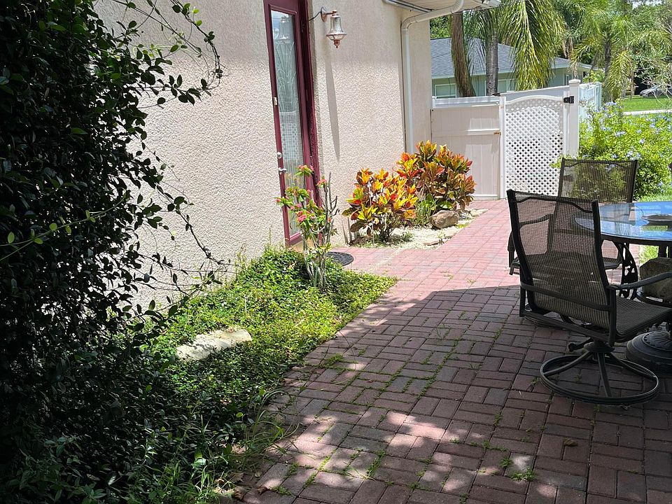 Private entrance to apartment with patio area.