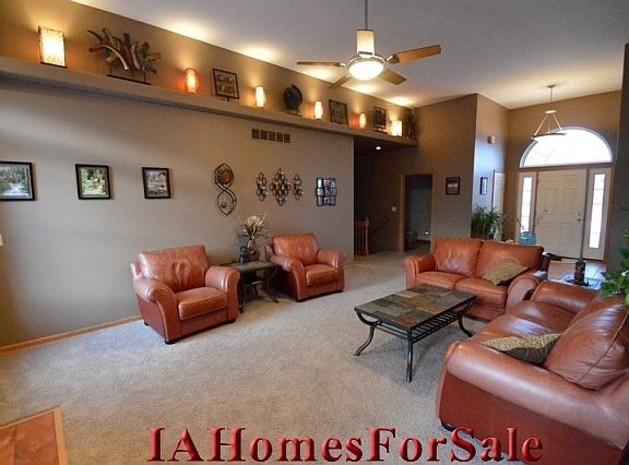 Living Room - Spacious main living area with 12 foot ceilings.