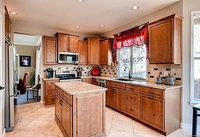 Updated kitchen with solid granite countertops, stainless steel appliances and t