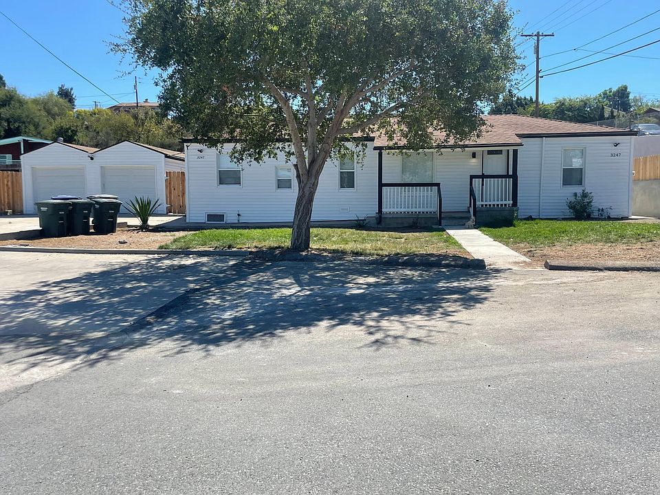 Front with shade tree