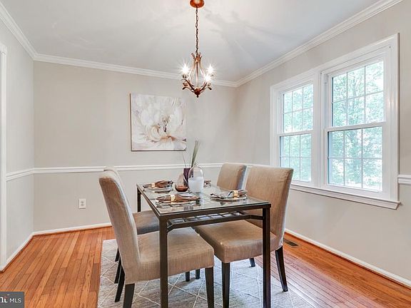 Formal dining room with chair and crown molding