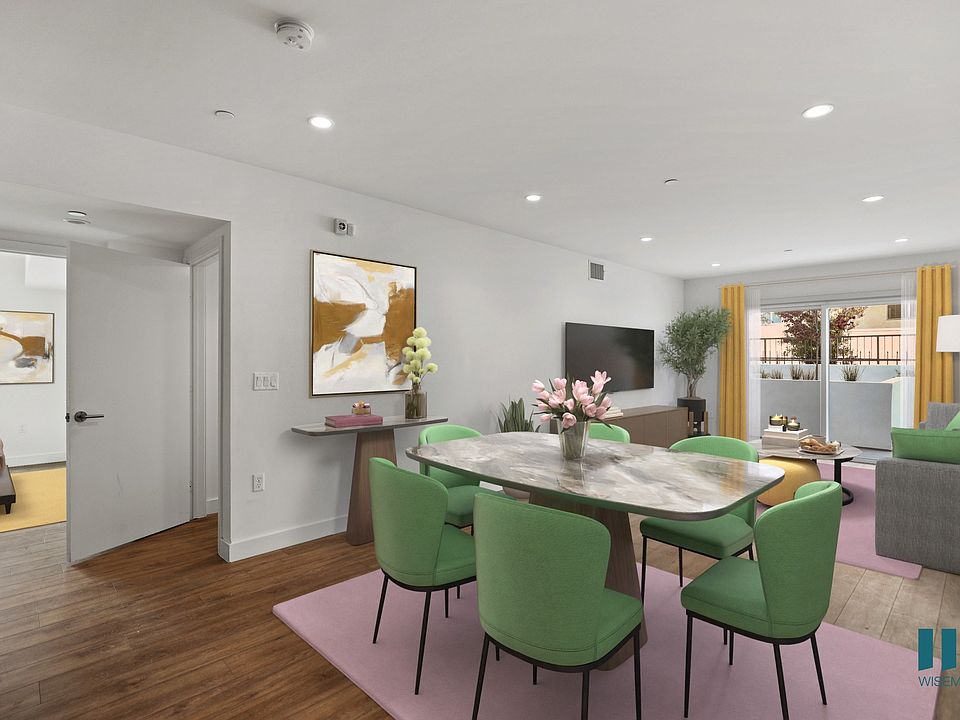 Open-Concept Dining and Living Room with Patio