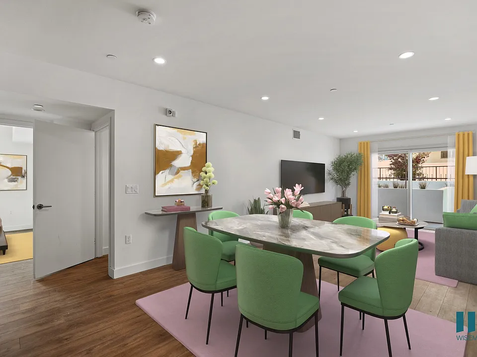 Open-Concept Dining and Living Room with Patio