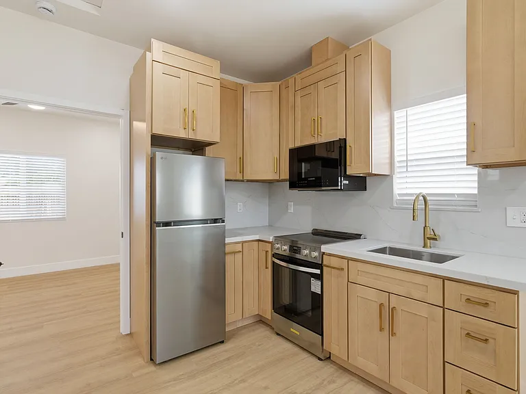 New oak cabinets and quartz countertops.