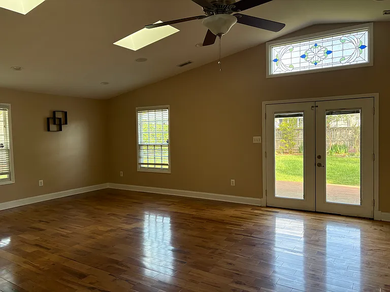 Family room french doors open to private rear yard