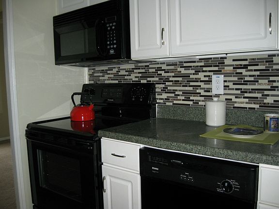 new stove, never used. New glass tile back splash