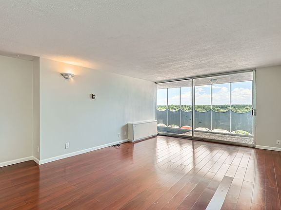 Large living area with floor to ceiling glass doors!