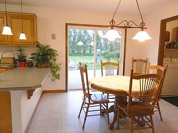 Convenient dining area with access to back deck
