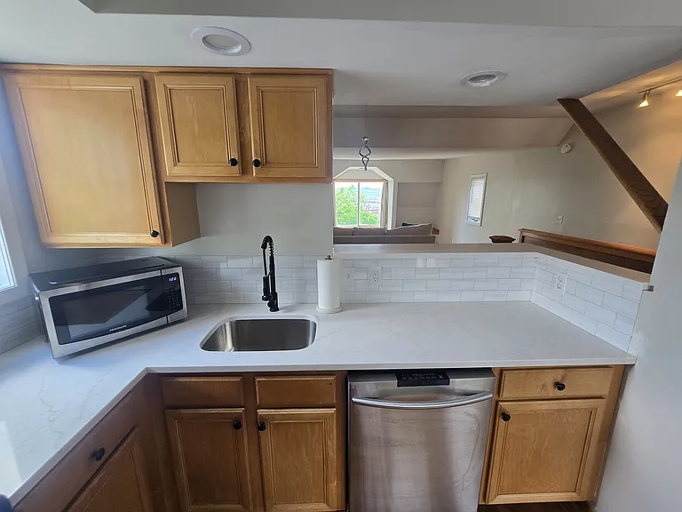 New Quartz Countertops, Sink and faucet and backsplash installed