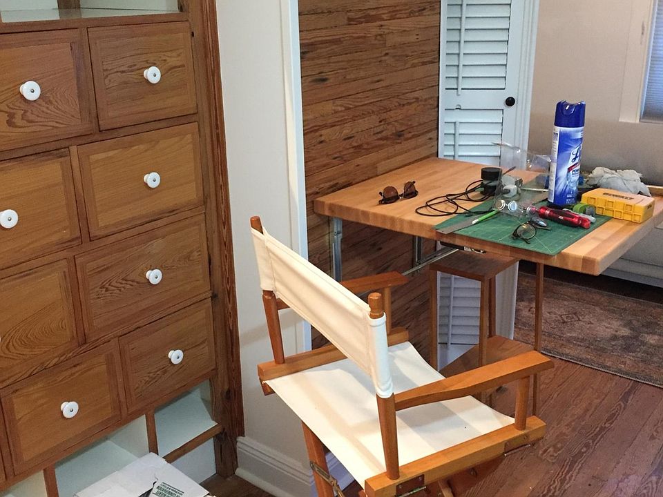Drop down/ pop up, chopping block table. Built in drawers and storage shelves under loft access.