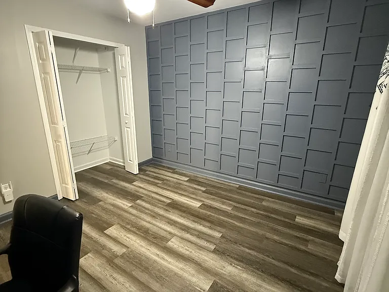 Office Room/Bedroom with Closet facing Street on Top Floor with Accent Wall