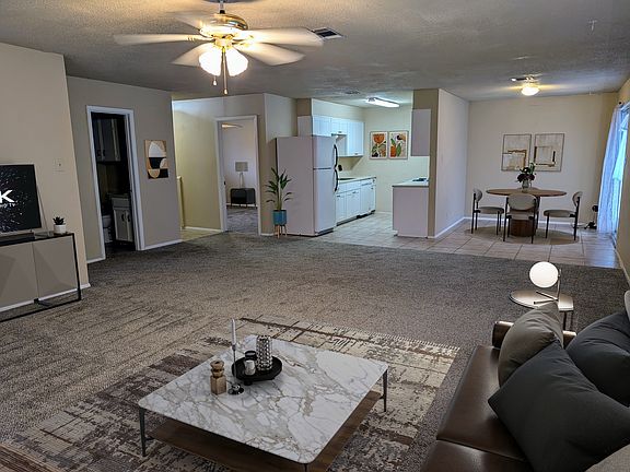 Just inside the front door there is a space for a dining table or the space is frequently used for a home office (see other entry photo for example) Staged furnishings.