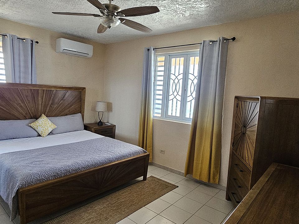 Bedroom with king size bed and new furniture with AC