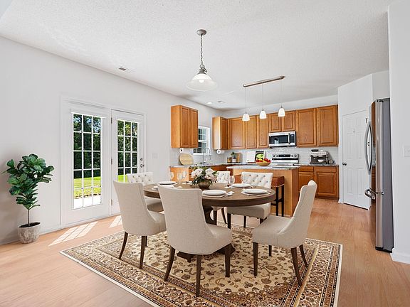 Eating area in the great room, Photo virtually staged.
