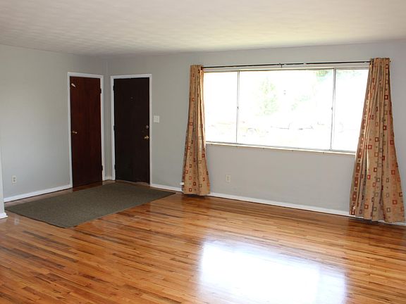 Living Room features newly refinished wood floors