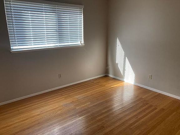 Right side downstairs bedroom (10' x 12'). with oak hardwood floor