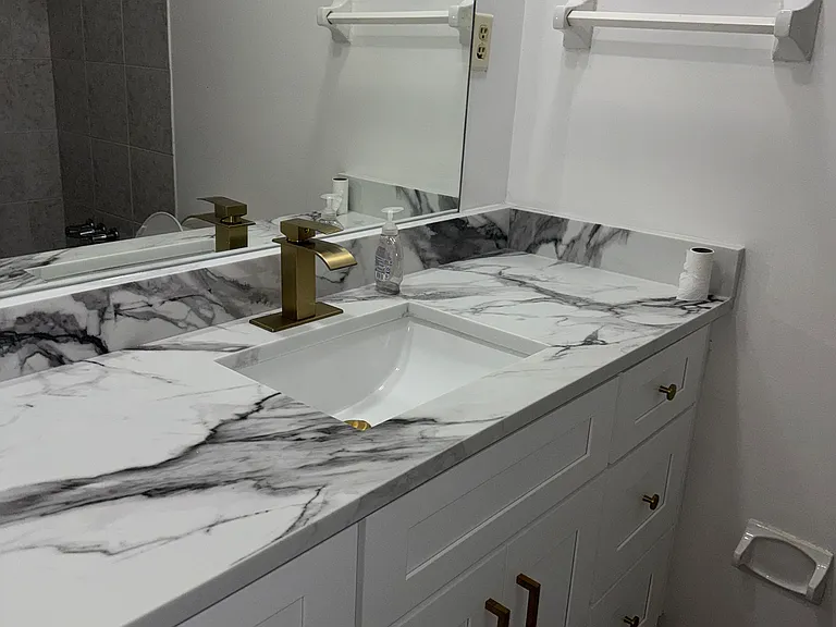 full bathroom in the hallway. new sink and cabinets