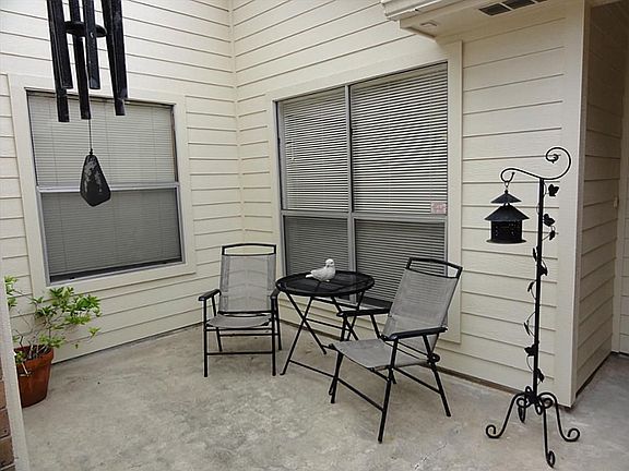 You have a perfect sitting area just before entering the front door. What a great place to relax and