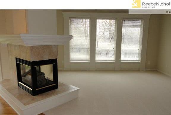 Great Room-new carpet 3 sided, see through gas fireplace with ra