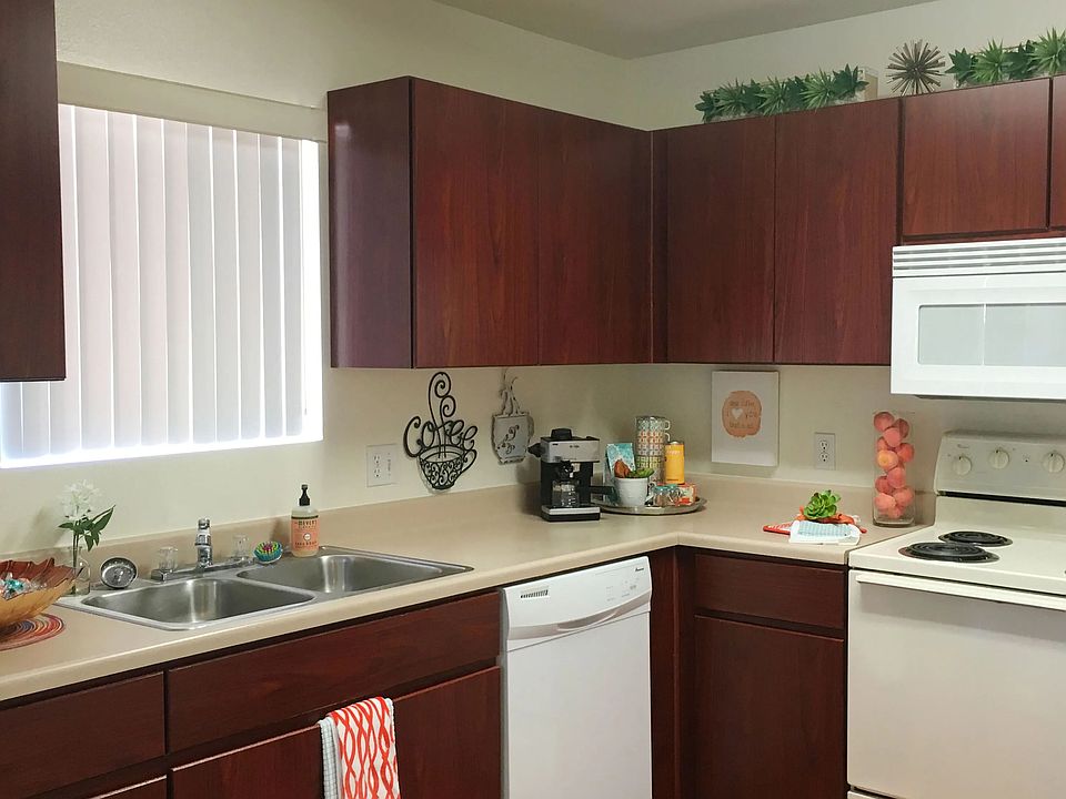 Experience the charm of our timeless kitchen design, complete with ample countertops for meal prep and abundant cabinets for storage.