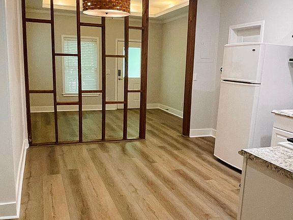 Open-concept living, breakfast dining, and kitchen.