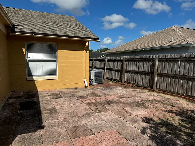 Brick lined patio within the backyard