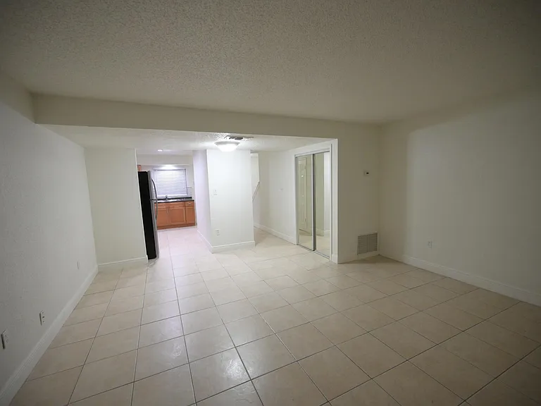 From the sliding glass doors into the kitchen and hallway
