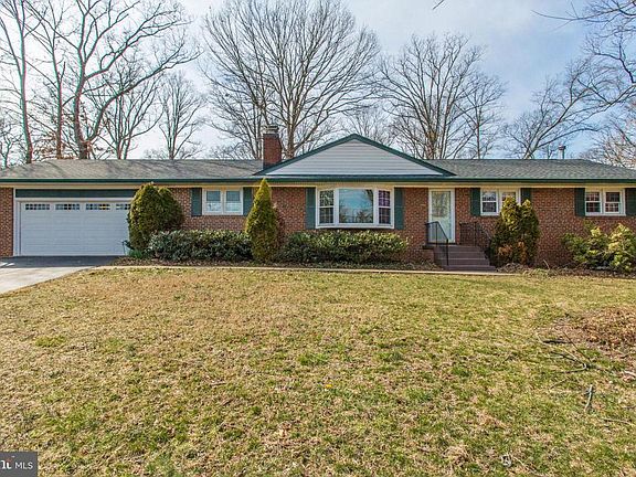 Two car garage with shelving and more.
