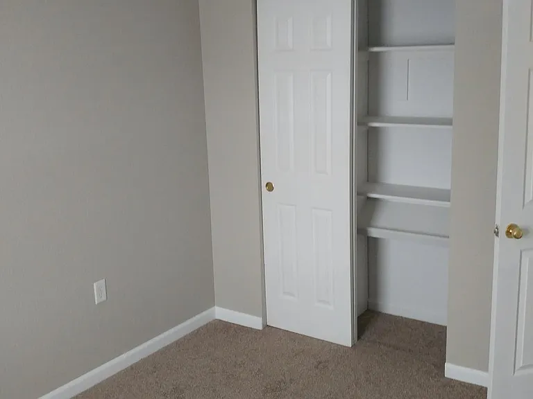 2nd bedroom. The 3rd bedroom is almost identical. Both with window view of the Castle Rock.