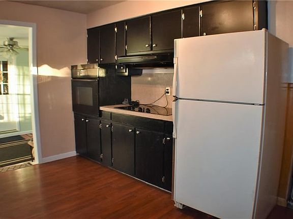 Another view of kitchen showing the handy access to the sunny breezeway, where meals could be served!
