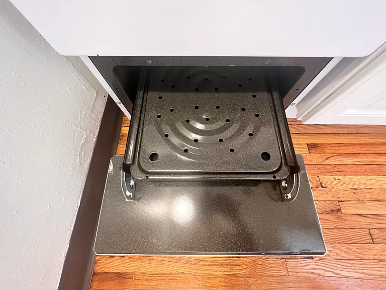 Gas range has separate broiler.