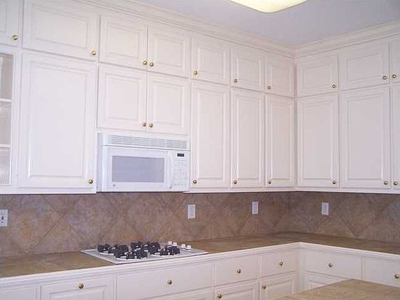 large kitchen with double ovens