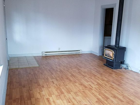 Living room view with kitchen entrance