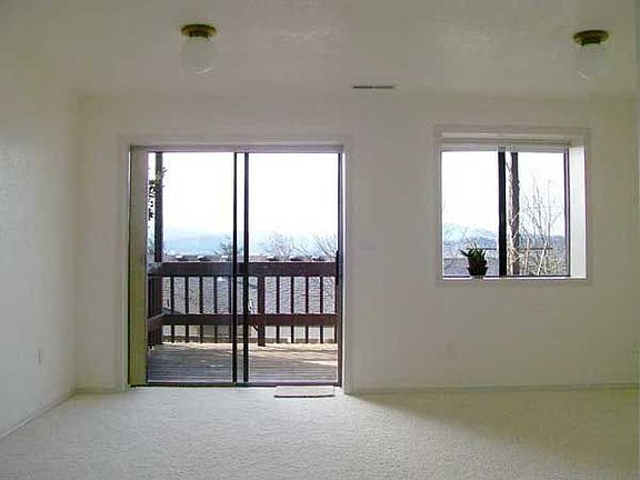 Downstairs family room with deck and view