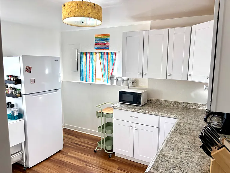 private kitchen with full appliances, microwave, stove and cooking gear