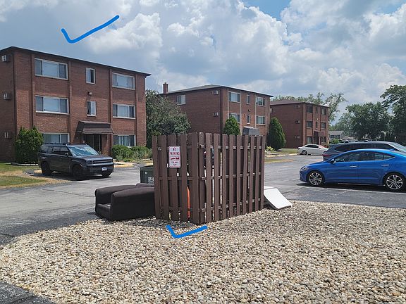 Front side of the building - West Facing - Garbage - Dumpster