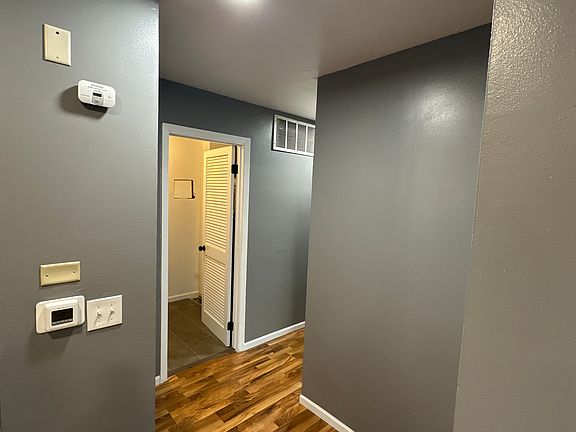 Hallway leading to laundry room on the left
