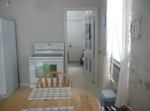 Kitchen w/new appliances, w/pantry and inside basement access.