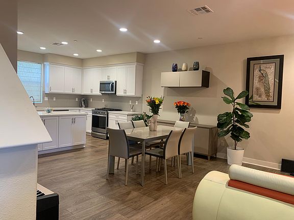 view from stairs of dining room and kitchen
