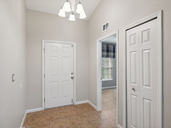 Entry (bedroom 4 is to the left of the front door. It is a full bedroom with a closet, window and door)