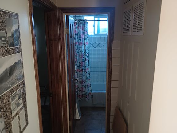 Looking into the bathroom, tile floors throughout keep the unit cool.