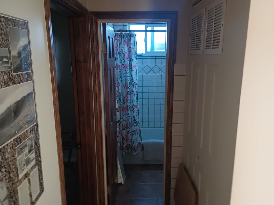 Looking into the bathroom, tile floors throughout keep the unit cool.